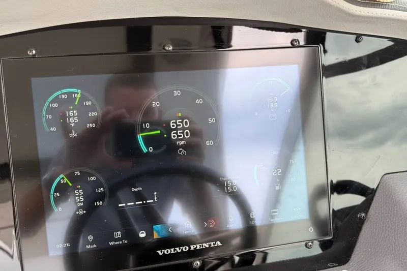 Slide: The Image of Dashboard display of a 2025 Regal 33 Express boat with Volvo Penta controls. - 8