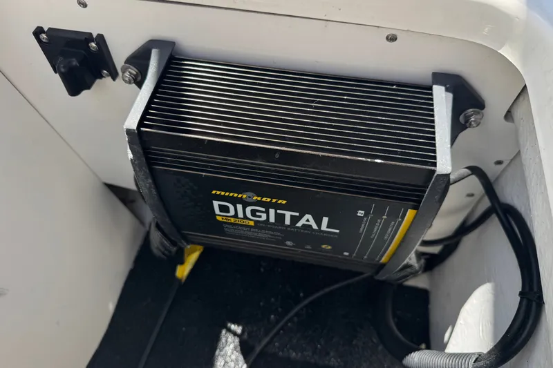 Slide: The Image of Minn Kota digital battery charger installed on 2013 Sea Ray 220 Sundeck boat. - 23