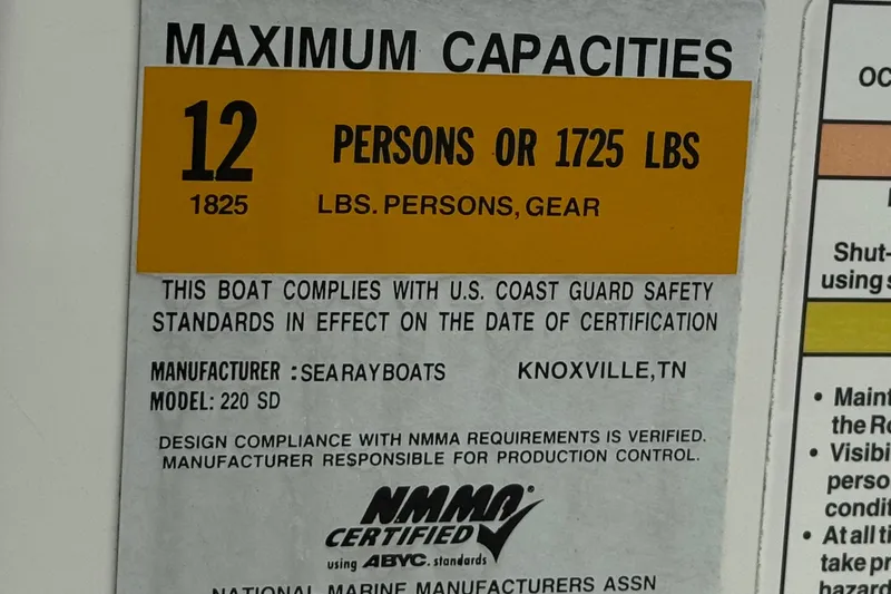 Slide: The Image of Sea Ray 220 Sundeck 2013 capacity label, 12 persons or 1725 lbs, NMMA certified. - 37