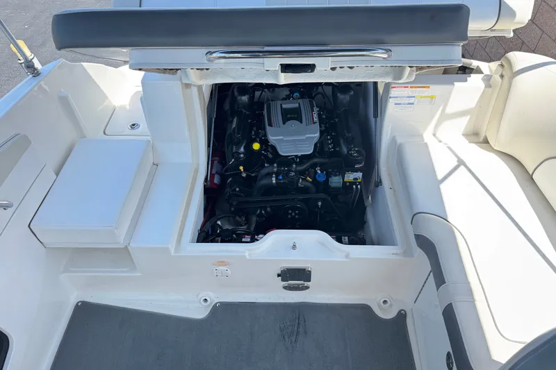 Slide: The Image of 2013 Sea Ray 220 Sundeck engine compartment, showcasing clean and organized layout. - 18