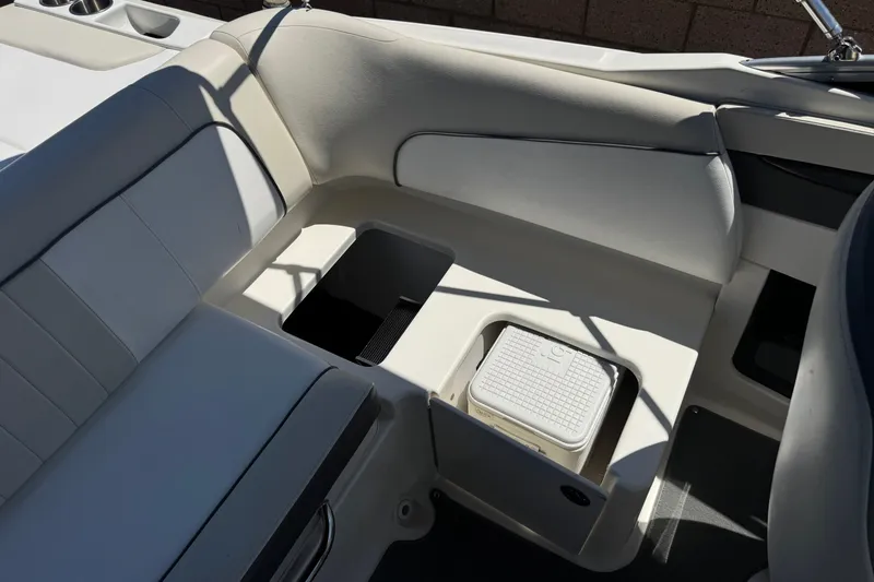 Slide: The Image of Interior seating and storage of 2013 Sea Ray 220 Sundeck boat. - 22