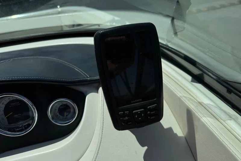Slide: The Image of Dashboard of 2013 Sea Ray 220 Sundeck with Garmin GPS and gauges. - 32