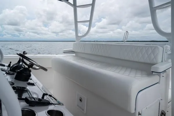 Slide: The Image of Interior view of 2016 SeaHunter 45 Tournament boat with white seating and steering console. - 21