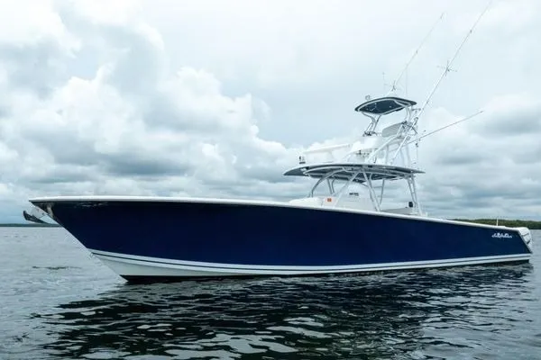 Slide: The Image of 2016 SeaHunter 45 Tournament boat on water under cloudy sky. - 37
