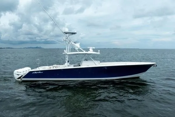 Slide: The Image of 2016 SeaHunter 45 Tournament boat on open water under cloudy skies. - 33