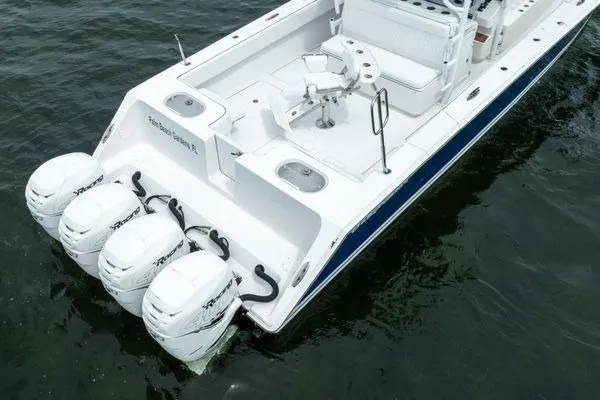 Slide: The Image of 2016 SeaHunter 45 Tournament boat with four powerful outboard engines on the water. - 4
