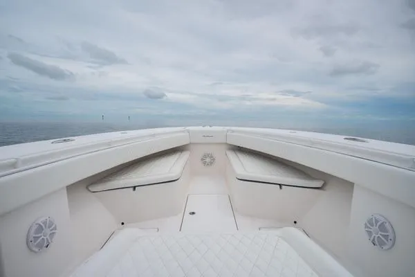 Slide: The Image of 2016 SeaHunter 45 Tournament boat interior with cushioned seating and ocean view. - 8