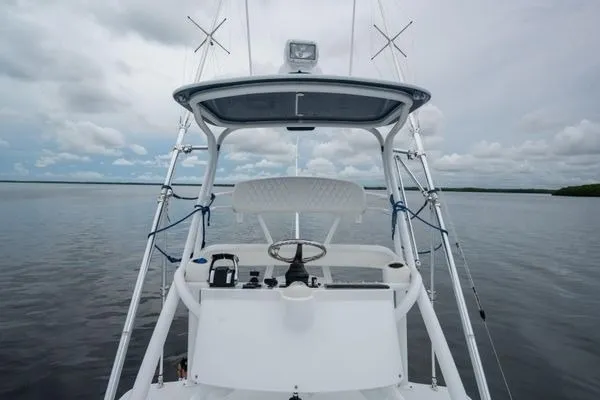 Slide: The Image of 2016 SeaHunter 45 Tournament boat on calm waters under cloudy sky. - 13
