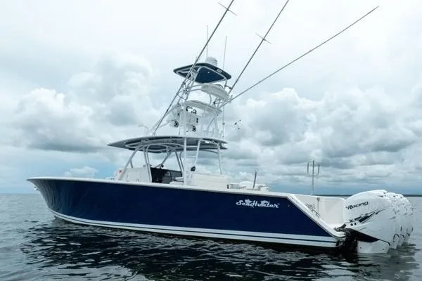 Slide: The Image of 2016 SeaHunter 45 Tournament boat on open water under cloudy skies. - 35