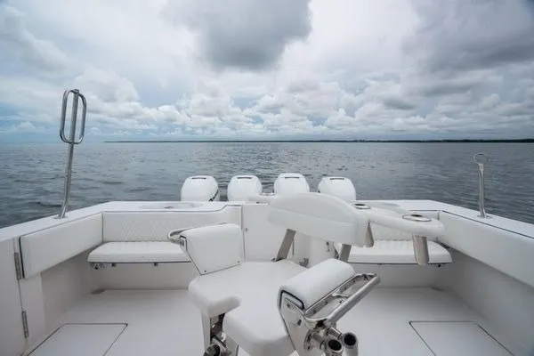 Slide: The Image of 2016 SeaHunter 45 Tournament boat interior with seating, overlooking calm ocean waters. - 26