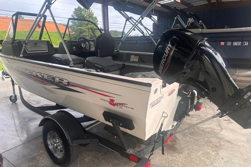The Image of 2021 Tracker Pro Guide V-16 WT boat with Mercury outboard motor on trailer. - 0