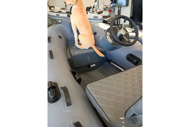 Slide: The Image of Dog sitting in a 2026 DESNER ALUMINUM CL 310 boat interior. - 3