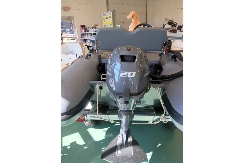 Slide: The Image of 2026 DESNER ALUMINUM CL 310 boat with Yamaha 20 outboard motor in showroom. - 4