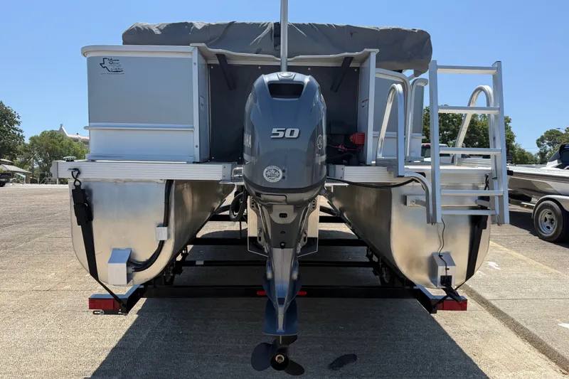 Slide: The Image of 2020 SunCatcher V18 Fish pontoon boat with Yamaha 50 outboard motor, parked on trailer. - 9