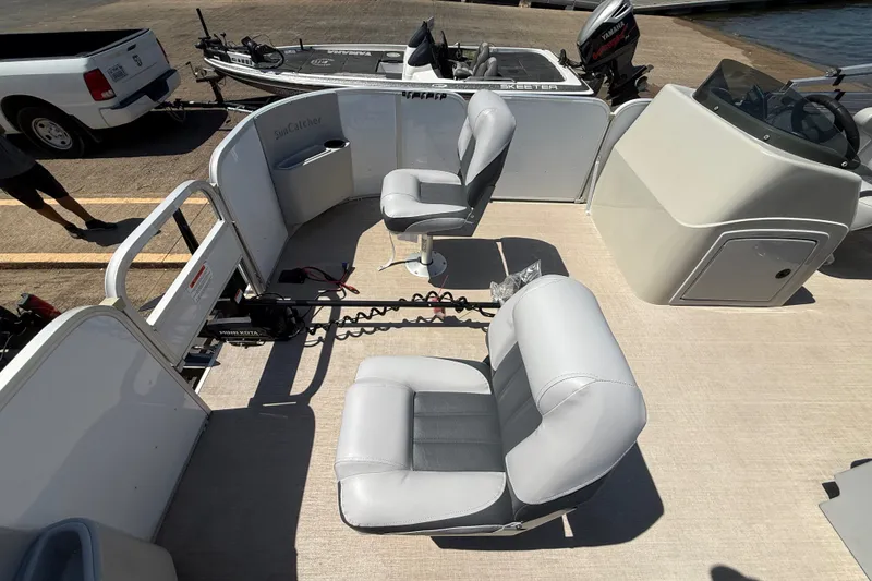 Slide: The Image of 2020 SunCatcher V18 Fish boat interior with seating and steering console. - 24