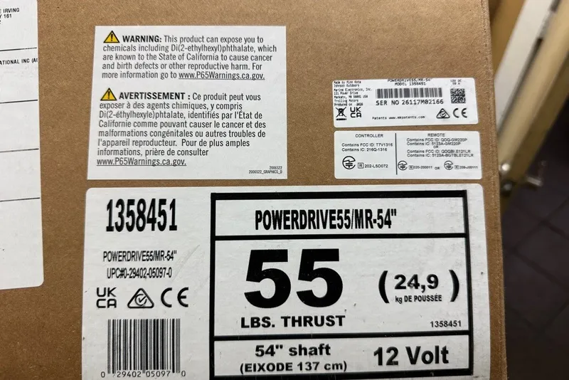 Slide: The Image of Cardboard box with warning labels and specifications for a PowerDrive 55 motor, 54" shaft, 12 Volt. - 46