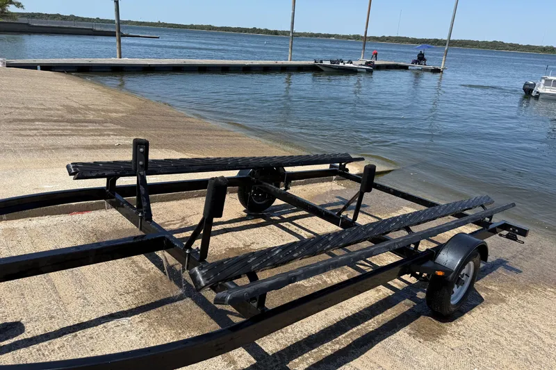 Slide: The Image of Boat trailer at a lakeside ramp, ready for SunCatcher V18 Fish, 2020 model. - 35