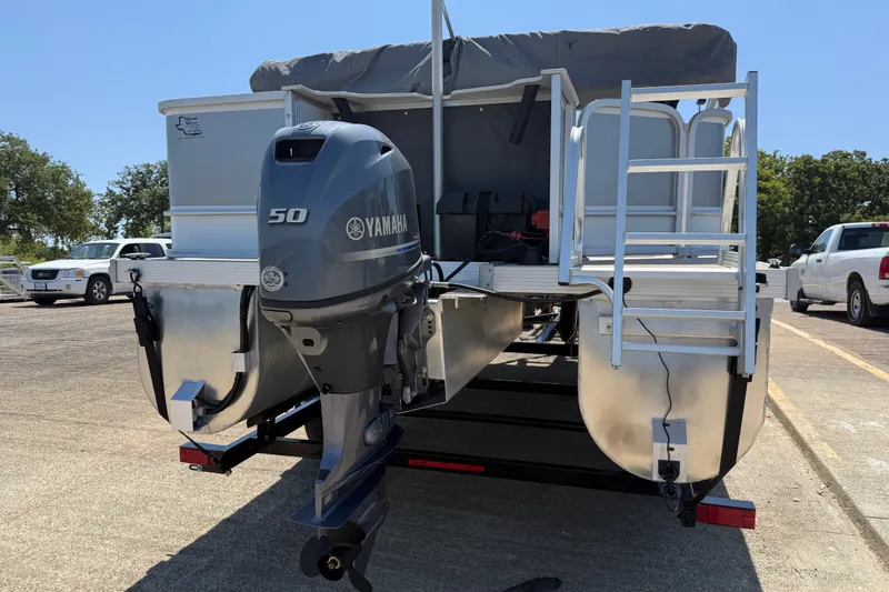 Slide: The Image of 2020 SunCatcher V18 Fish pontoon boat with Yamaha 50 outboard motor, parked on trailer. - 8