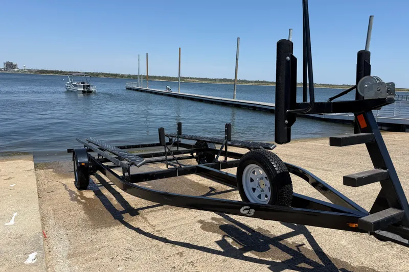 Slide: The Image of Boat trailer near water with docked boats, SunCatcher V18 Fish, 2020 model. - 37