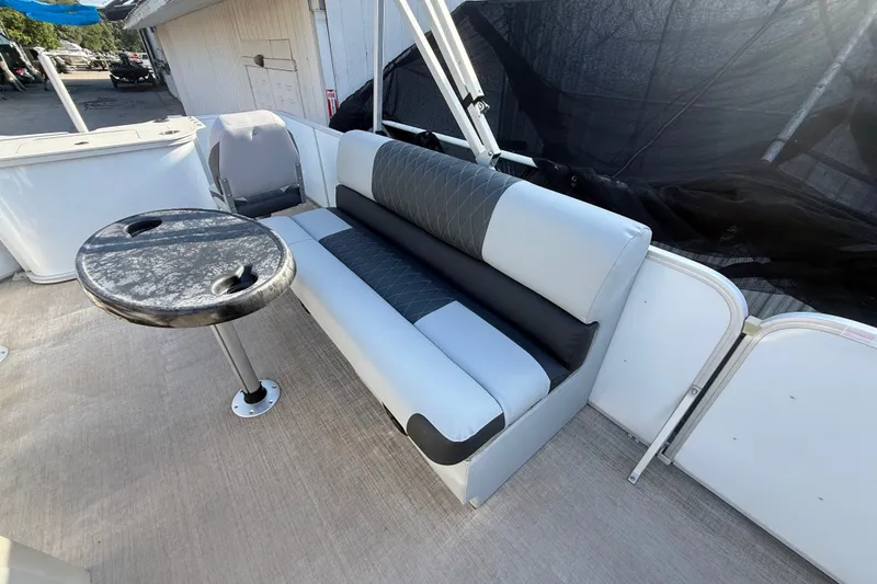 Slide: The Image of 2020 SunCatcher V18 Fish boat interior with seating and table. - 40