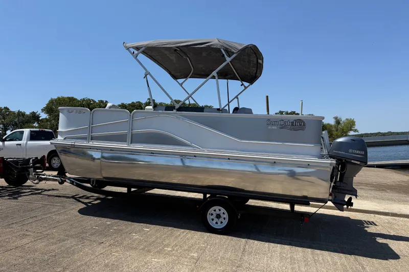 Slide: The Image of 2020 SunCatcher V18 Fish pontoon boat with Yamaha motor on trailer by the lake. - 31