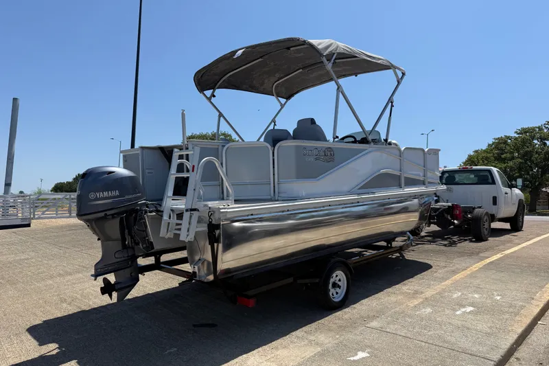 Slide: The Image of 2020 SunCatcher V18 Fish pontoon boat on trailer, equipped with Yamaha outboard motor. - 29