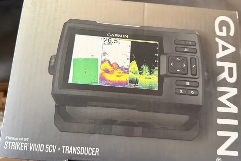 Slide: The Image of Garmin Striker Vivid 5CV fishfinder with transducer, displayed on packaging. SunCatcher V18 Fish 2020. - 49