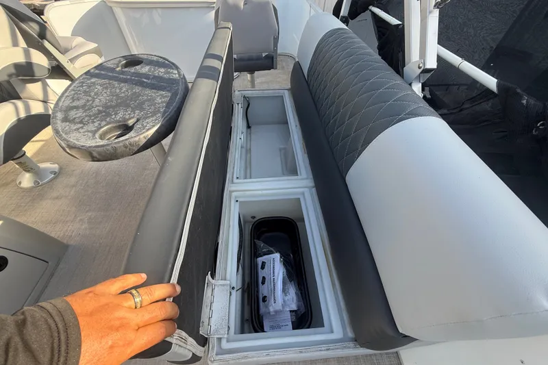 Slide: The Image of 2020 SunCatcher V18 Fish boat interior with storage compartment and seating. - 41