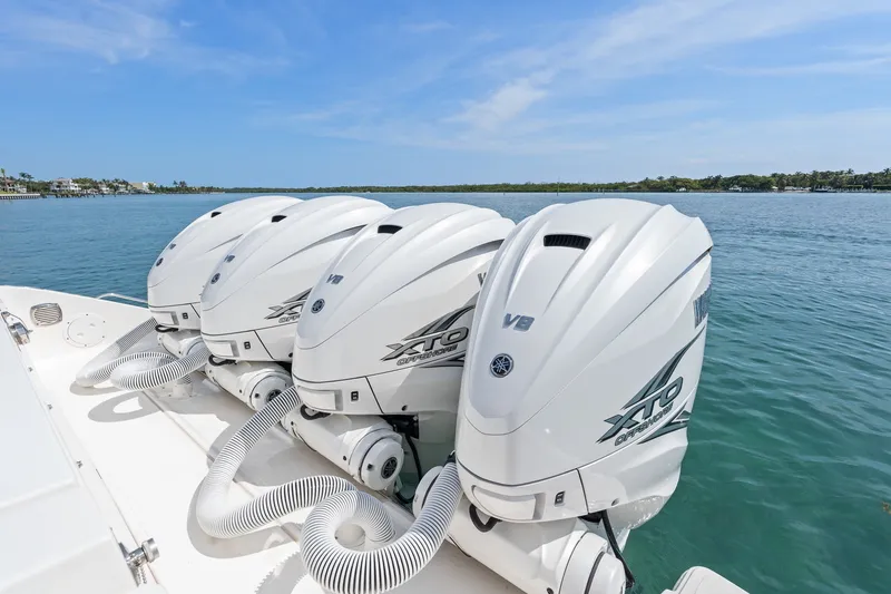 Slide: The Image of Triple Yamaha XTO Offshore V8 engines on a 2022 Pursuit S 428 Sport boat. - 26