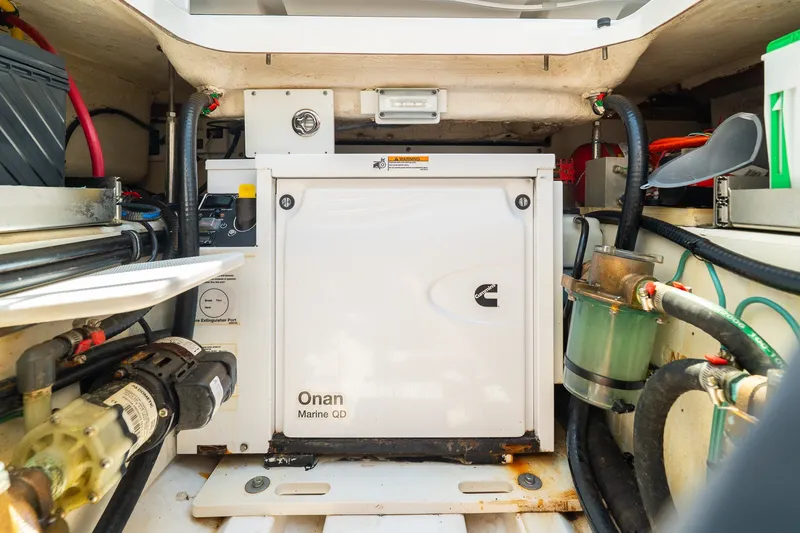 Slide: The Image of Engine compartment of 2022 Pursuit S 428 Sport with Onan Marine QD generator. - 53