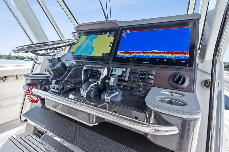 Slide: The Image of 2022 Pursuit S 428 Sport boat dashboard with advanced navigation displays. - 41