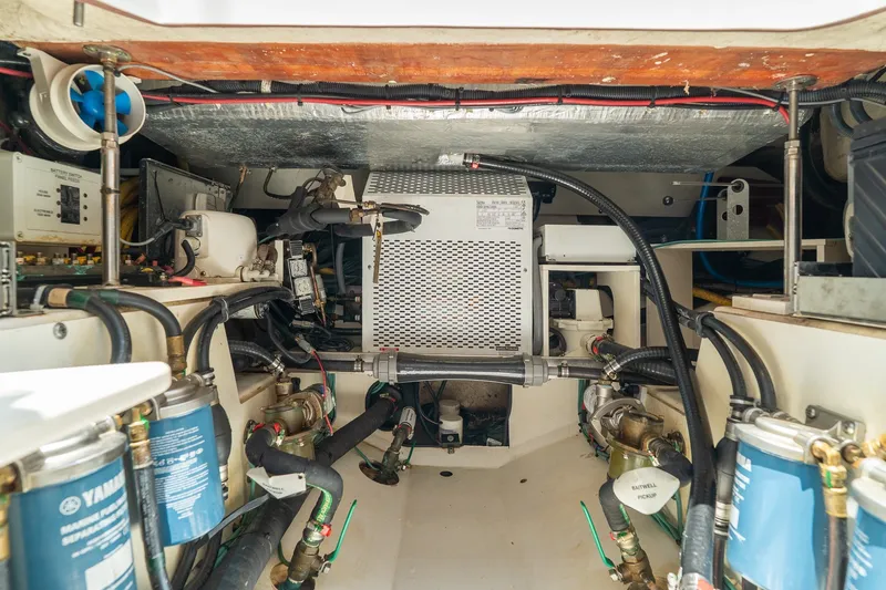 Slide: The Image of Engine room of 2022 Pursuit S 428 Sport boat with Yamaha components and wiring. - 54