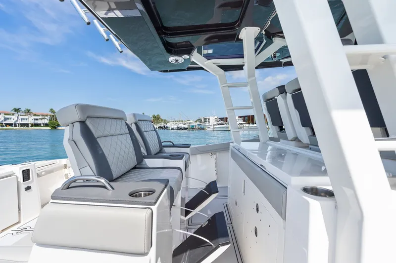 Slide: The Image of 2022 Pursuit S 428 Sport boat interior with luxurious seating and ocean view. - 35
