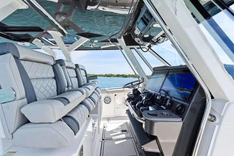 Slide: The Image of 2022 Pursuit S 428 Sport boat interior with luxury seating and advanced navigation system. - 39