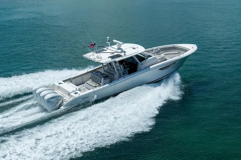 Slide: The Image of 2022 Pursuit S 428 Sport boat cruising on open water. - 20