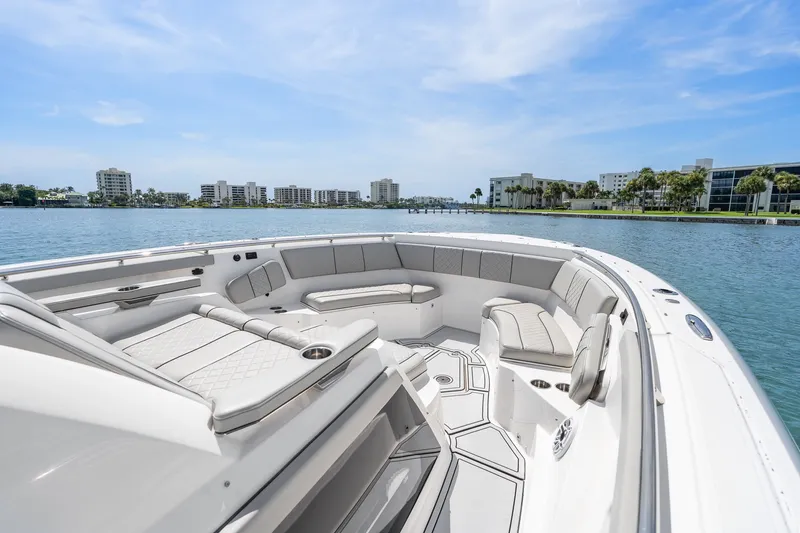 Slide: The Image of Luxurious 2022 Pursuit S 428 Sport boat interior with waterfront cityscape view. - 44