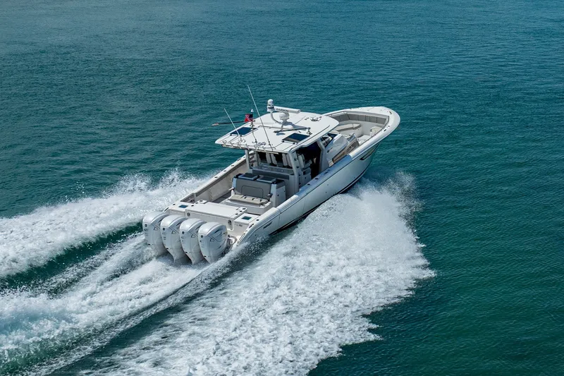 Slide: The Image of 2022 Pursuit S 428 Sport boat cruising on open water. - 21