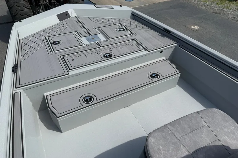 Slide: The Image of 2026 Avid 20 Rogue CC boat interior with sleek, modern design and storage compartments. - 19