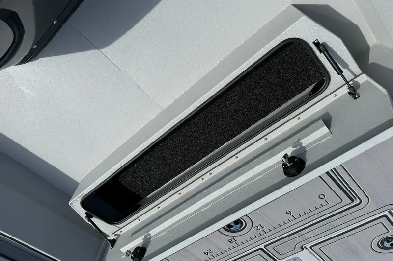 Slide: The Image of Storage compartment on 2026 Avid 20 Rogue CC boat, featuring sleek design and secure latches. - 23