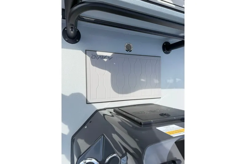 Slide: The Image of 2026 Avid 20 Rogue CC boat interior detail with storage compartment and console. - 15