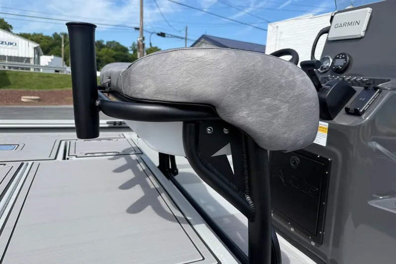 Slide: The Image of 2026 Avid 20 Rogue CC boat interior with Garmin navigation system and cushioned seating. - 14