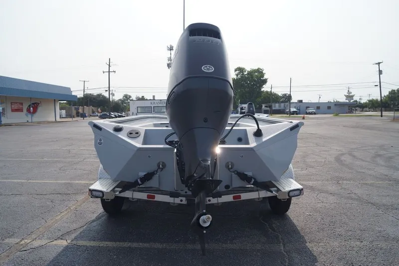 Slide: The Image of 2026 Excel 220 Bay Pro Elite boat on trailer, rear view in parking lot. - 4
