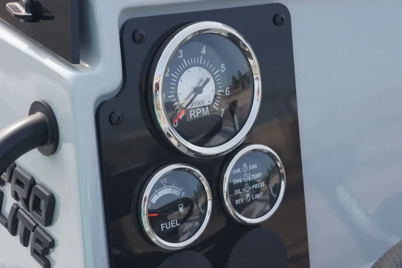 Slide: The Image of Close-up of 2026 Excel 220 Bay Pro Elite boat dashboard gauges. - 18