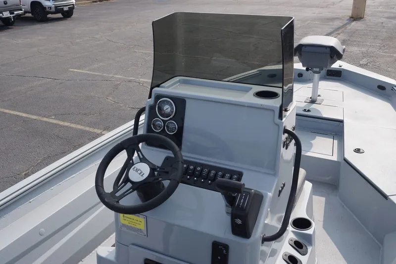 Slide: The Image of Steering console of 2026 Excel 220 Bay Pro Elite boat with gauges and controls. - 9