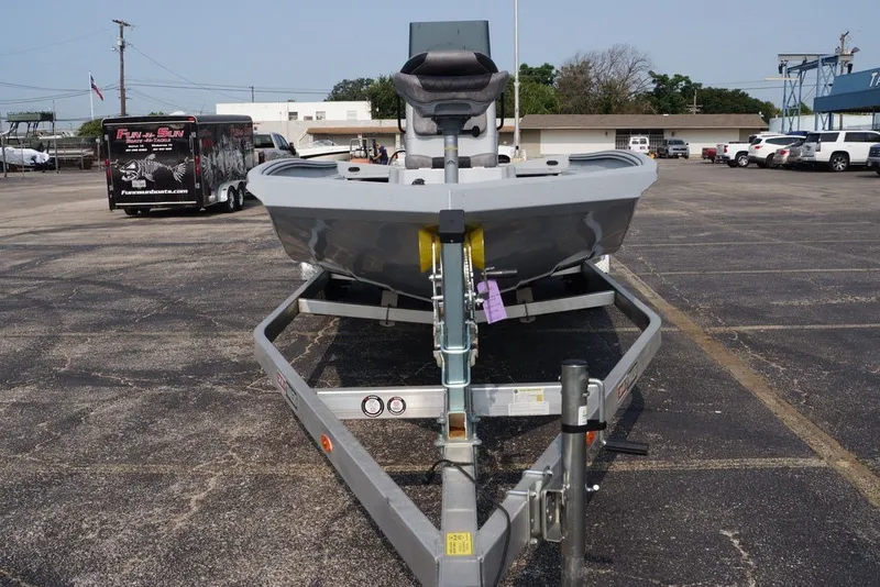 Slide: The Image of 2026 Excel 220 Bay Pro Elite boat on trailer in parking lot. - 2