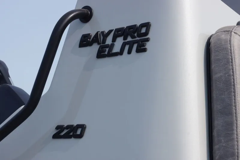 Slide: The Image of 2026 Excel 220 Bay Pro Elite boat branding detail with sleek design. - 11