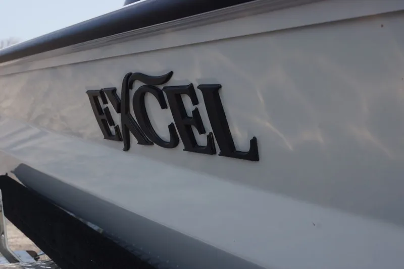Slide: The Image of 2026 Excel 220 Bay Pro Elite boat side view with logo. - 6
