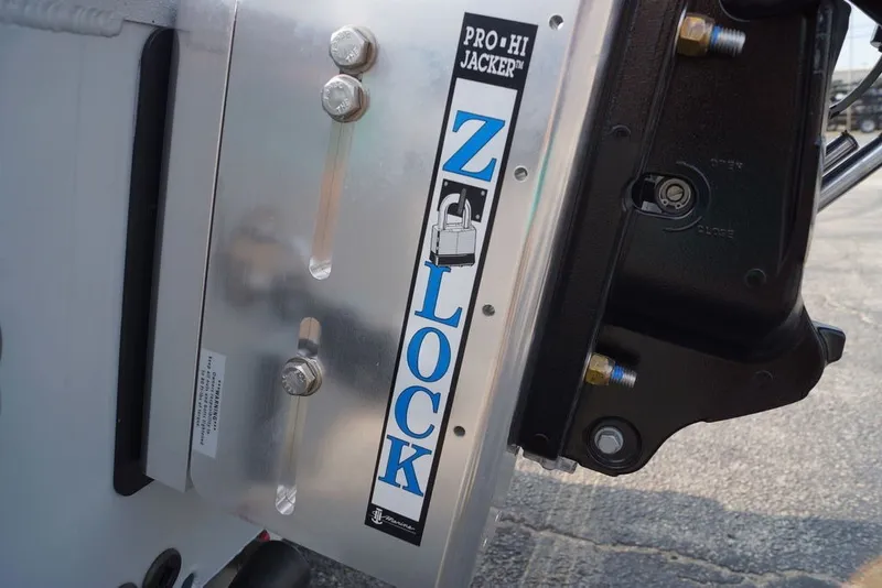 Slide: The Image of Excel 220 Bay Pro Elite 2026 boat with Pro-Hi Jacker Z-Lock system detail. - 13
