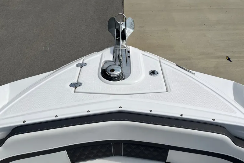 Slide: The Image of Bow of 2025 Monterey M6 boat with anchor and sleek design. - 16
