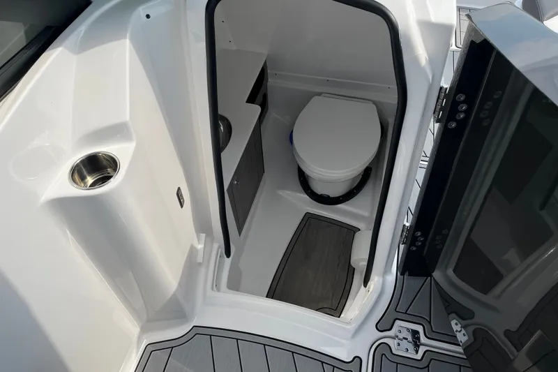 Slide: The Image of 2025 Monterey M6 boat interior with compact bathroom and modern design. - 14